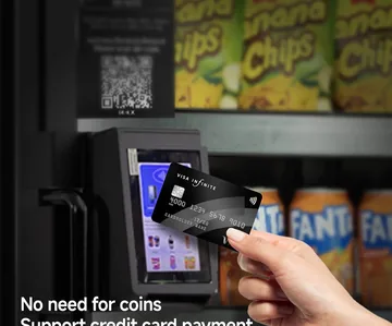 Close-up of a card tapping the built-in card reader on the machine door